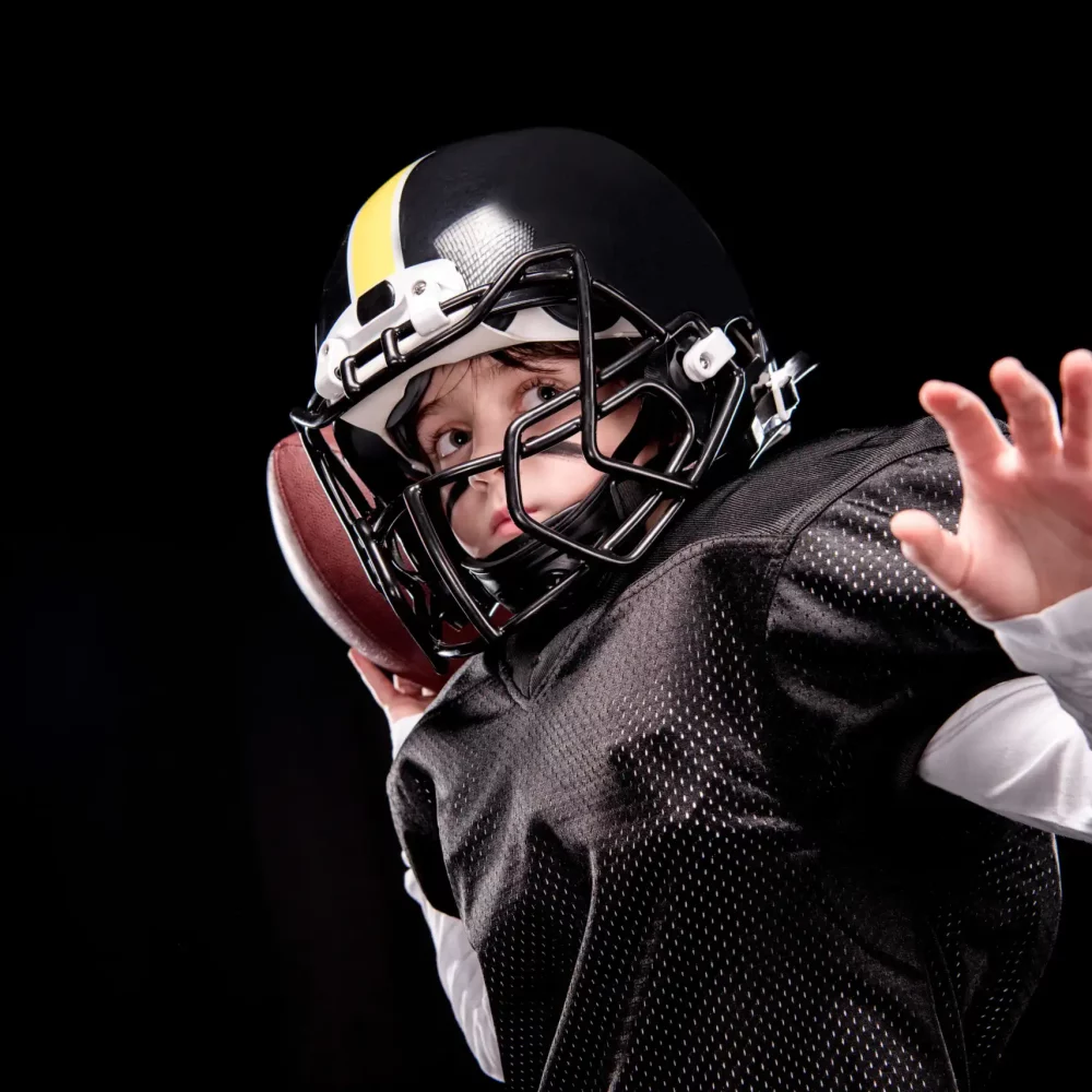 little-boy-american-football-player-in-uniform-thr-2021-09-01-01-49-14-utc-scaled